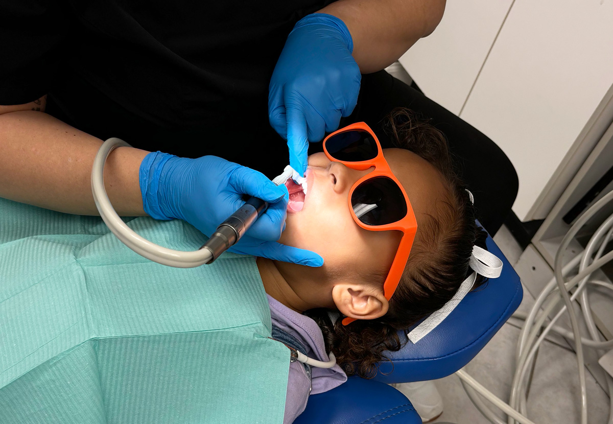 Young girl during her routine dental cleaning at HERO pediatric dentistry.
